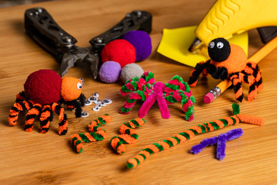 Fun Halloween Crafts.  Spiders made of pom poms and pipe cleaners.  Attach to pencils.