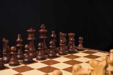 Close View to the Pieces an a Chessboard.