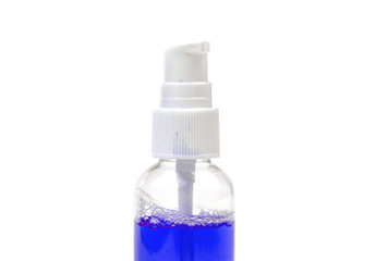 tool for tooth rinse in bottle on white isolated background