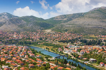 Fototapeta na wymiar View of Trebinje city and Trebisnjica river from Crkvina Hill on sunny summer day. Bosnia and Herzegovina, Republika Srpska