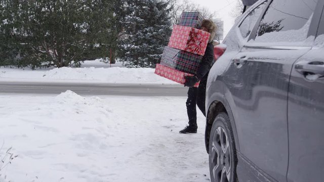 Man slips on ice carrying Christmas gifts