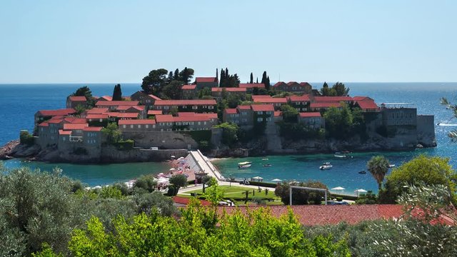 Adriatic Sea and Sveti or Saint Stefan in Montenegro. Sveti Stefan - resort and small islet in Montenegro, located on the Adriatic coast, on the Budva Riviera, 6 kilometers southeast of Budva