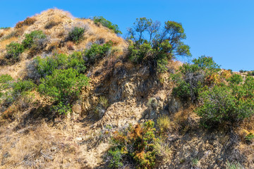 rocky hillsides from wind and sun