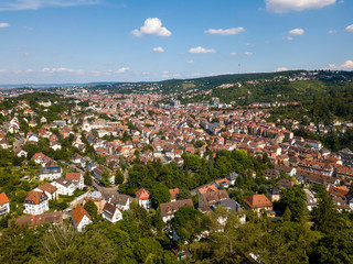Fototapeta na wymiar Aerial view of the southern parts and the tv tower of Stuttgart, one of the most important industrial cities in Germany.