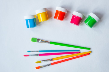 Colorful Paint Brushes with the Colors on a white background