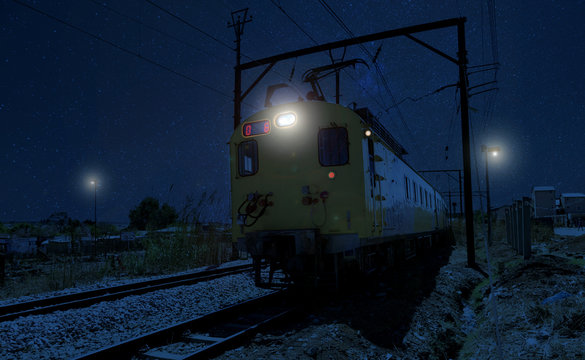 Commuter Train Moving Through The Heart Of Soweto Township At Night