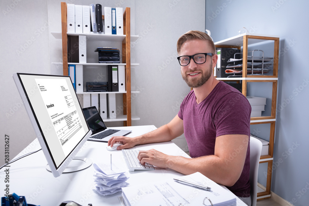 Poster businessman checking invoice on computer