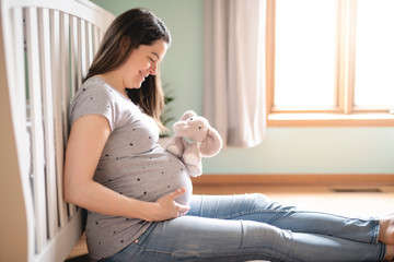 A Beautiful Pregnant mother on baby room