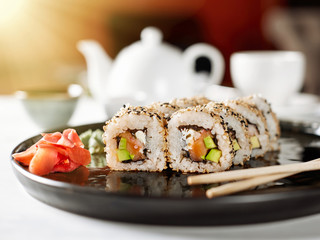 Closeup of japanese rolls on a dark plate