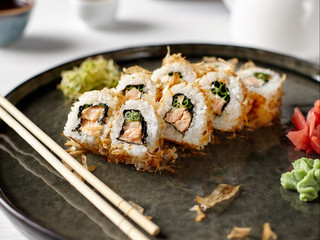 Closeup of japanese rolls on a dark plate