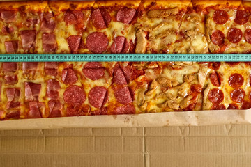 Measure pizza length with a tape measure