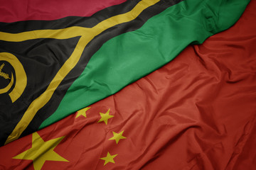 waving colorful flag of china and national flag of Vanuatu.