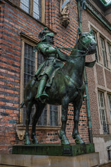 Fototapeta na wymiar Monument of a knight on horse in front of Cathedral in Bremen, Germany, Autumn