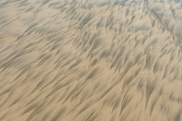Two color sand beach due to undertow. Geometric abstract pattern left by ocean tide