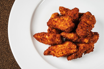 chicken nuggets on the white plate