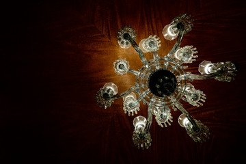 Photo of elegant chandelier in a luxury interior.