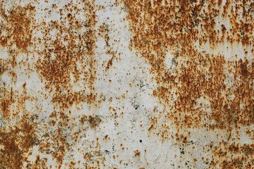 Old white painted wall with rust texture. Grunge rusted metal background. Rust stains.