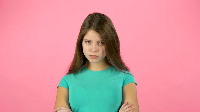 Cute female is changing her mood. Firtly she is angree disagree and then happy