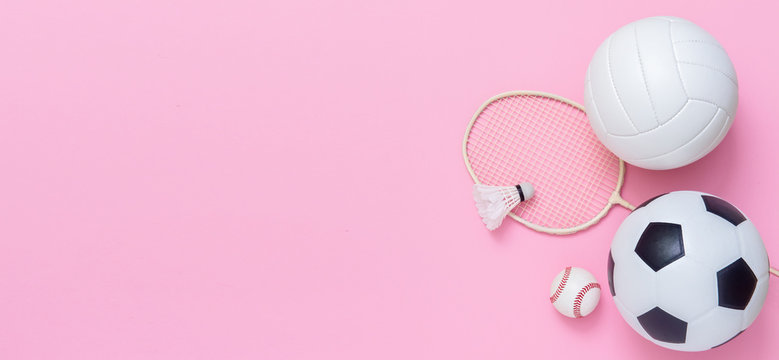 Photo of various sport equipments on pink background