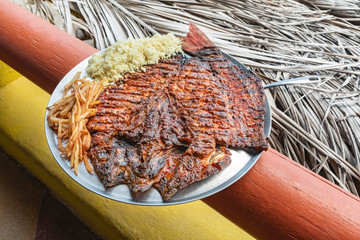 Delicious grilled fish Acapulco’s Style. Traditional Mexican barbecued fish called “Pescado a...