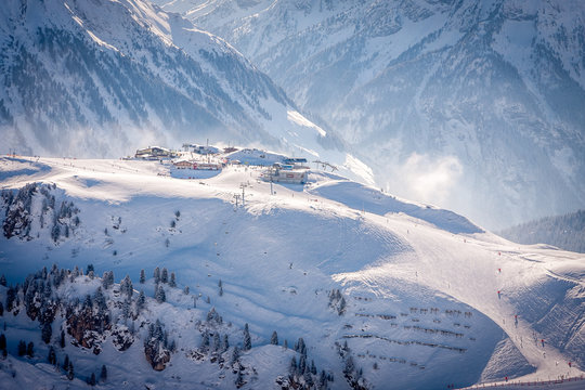 Mayrhofen, Austria Cafes and restaurants on a stop on the Penkenbahn lift on a background of snowy slopes