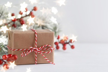 Christmas gift box and red holly berries
