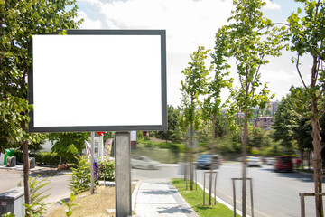 advertising board at bus stop on asphalt road