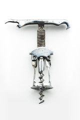 Antique vintage corkscrew on white background