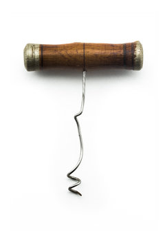 Antique vintage corkscrew on white background