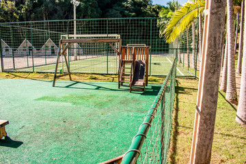 Fototapeta na wymiar Playground with children's slide and balance