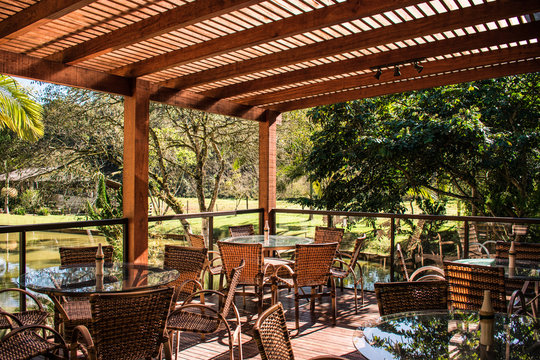 Wood Pergola And Tables In Garden Farm