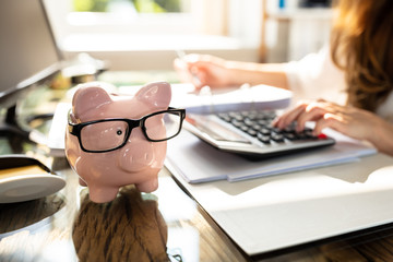 Pink Piggy Bank Over Office Desk