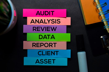 Audit, Analysis, Review, Data, Report, Client, Asset text on sticky notes isolated on Black desk. Mechanism Strategy Concept