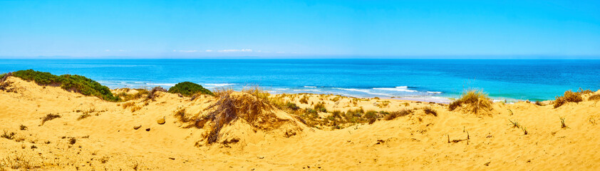 Panoramic view of The Faro de Trafalgar Beach, a broad beach of fine sand dunes of The Cabo de...