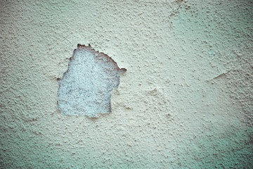 White old cracked wall plaster with rough surface -  Weathered vintage building facade