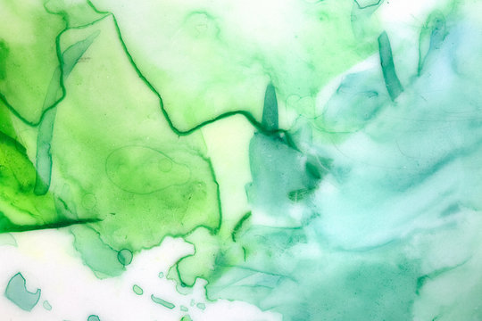 Artistic background with green watercolour brush strokes, blobs, splashes and washes. Hand painted water color painting on white. Beautiful graphic backdrop for card, poster, web site, flyer, design. © Julija