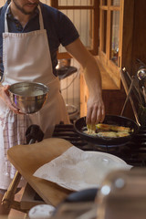 step by step process of cooking courgette flower Provence dish hands