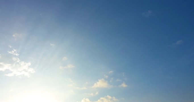 Beautiful bright clear blue sky white fluffy clouds on a clear sunny day. Royalty high-quality free stock time lapse footage of blue sky with white cloud. Time lapse of natural cloudscape background
