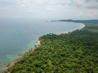 Fototapeta na wymiar Aerial view of tropical island jungle with palms and emerald clear water. Phu Quoc, Vietnam.