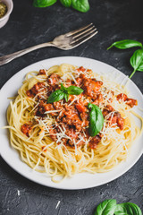 Spaghetti with bolognese sauce, parmesan and basil