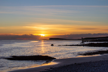 Fototapeta premium A viewpoint over the water at Salthill, Galway, Ireland is a popular place to watch the sunset on the Irish coast