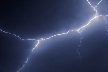 Fototapeta na wymiar lightnings and thunder bold stike at summer storm