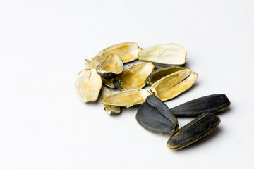 Roasted seeds,opened husk,sunflower seeds on a light background
