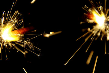 Hand sparkler on black background