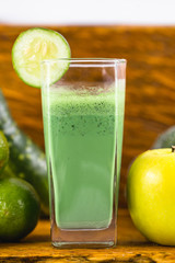 Fototapeta na wymiar Fresh green juice, Brazilian detox juice. Healthy food and diet concept.