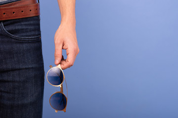 man holding glasses on his hands 