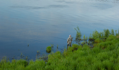 Man fishing by the river