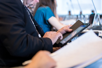 close up of business people hands using tablet computer
