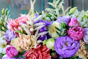 Fototapeten Flower background with rose, eustoma, carnation and spiraea. © agneskantaruk