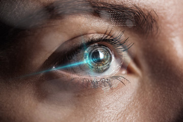 close up view of human eye with data illustration, robotic concept